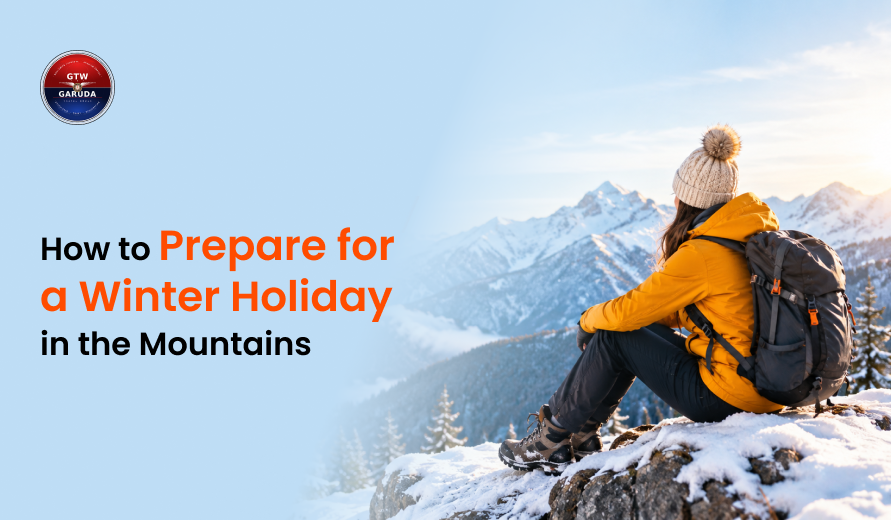 Traveler in warm winter clothing and a backpack sitting on a snowy mountain overlooking snow-covered peaks, illustrating how to prepare for a winter holiday in the mountains.